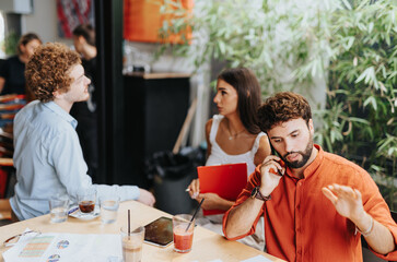 Architects, designers, and engineers discussing project costs and coordinating sustainable design. Corporate workplace focusing on innovation and efficient urban planning.