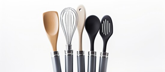 Baking utensils arranged on a background that is white