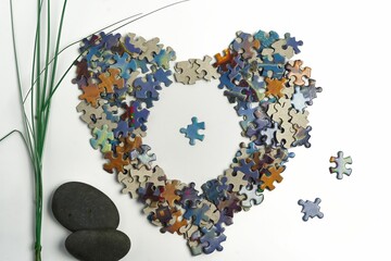 Puzzle pieces shaped in the form of a heart - the concept of a zen feeling of mind relaxation