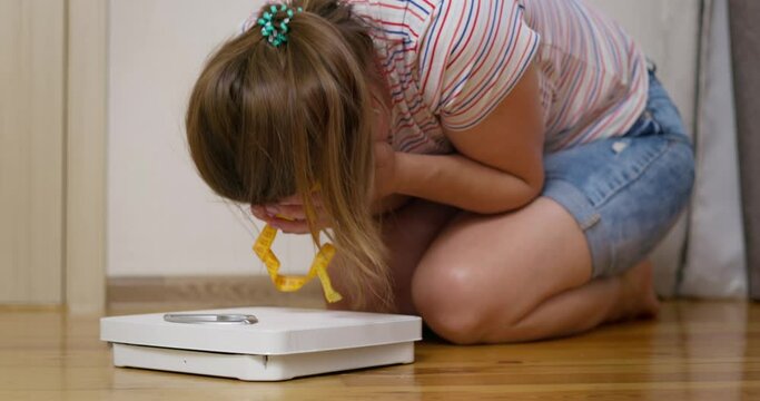 Libra and depressed, frustrated and sad woman crying while sitting on the floor