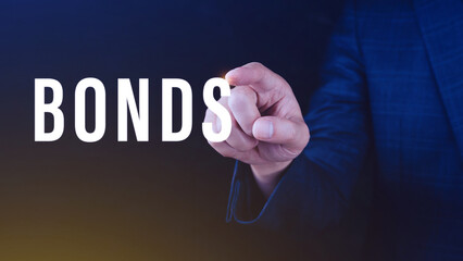 Businessman clicks bonds virtual screen. Bond Finance Banking Technology concept, Trade Market Network, bond security that indicates the investor has provided loan the issuer, Equivalent loan