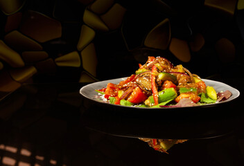 Eggplant salad, cherry tomatoes, red onion, sesame seeds. Chinese cuisine, home food, and restaurant.