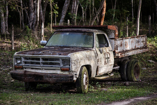 Classic pickup truck abandoned and rusty.