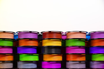 Multicoloured filaments spools of plastic for 3D printer. 3D printing technology