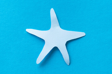 starfish paper cut isolated on blue