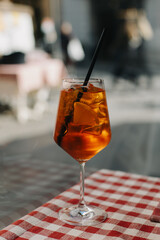Glass with cocktail on the table in a traditional Italian restaurant.