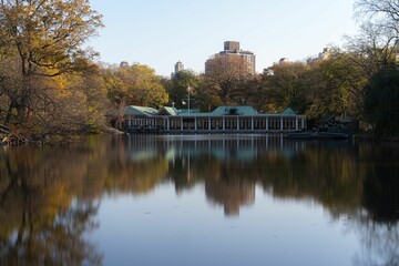 Fototapeta na wymiar Central Park boat house near the lake in central park, New York city surrounded by autumn trees