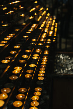 Burning candles in an old church.