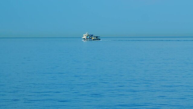 Fishing Ship In The Calm Sea. Fishing Boat Out In The Ocean Or Sea Wide. Still.