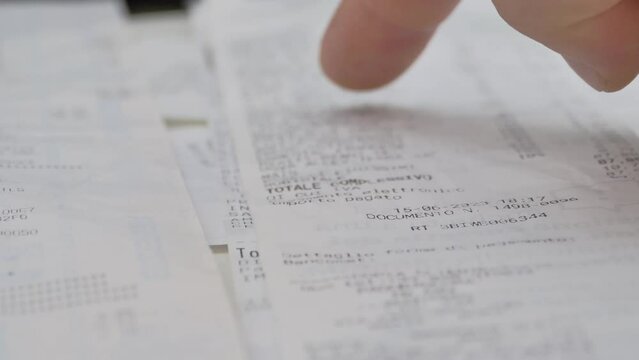 close-up, proofreading paper check, many different checks