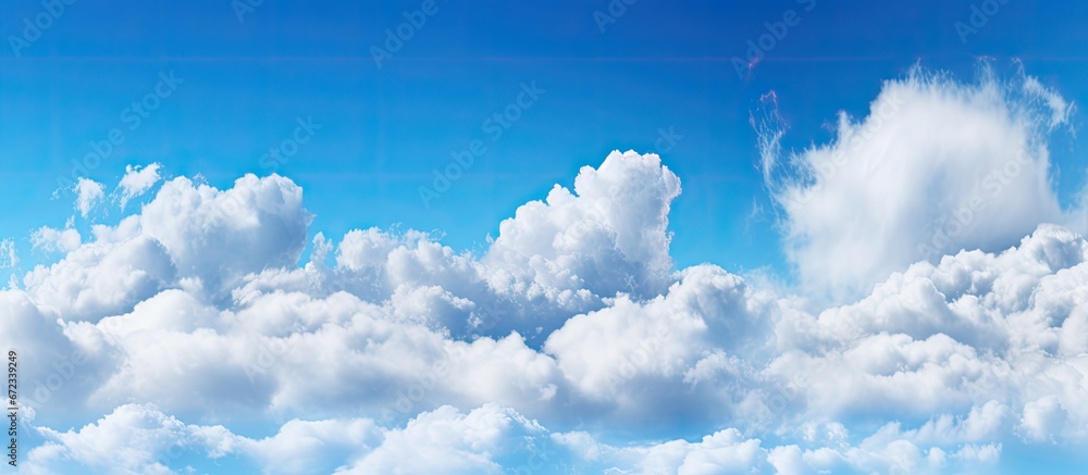 Canvas Prints Blurred sky panorama with a background of cumulus clouds against a blue sky