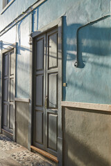 Historic Spanish architecture outdoors of a building in a overseas. Backdoor of a home or residential building. Two old blue doors to a traditional house outside in Santa Cruz de La Palma, Spain.