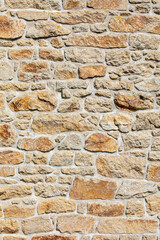 Vieux mur de pierre d'une maison ancienne en granit.