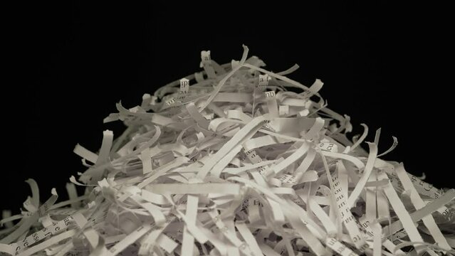Pile of shredded documents, secret information, lorem ipsum text. Secure disposal of sensitive data. Valuable private information is destroyed. Protection from identity theft, fraud, security risks.
