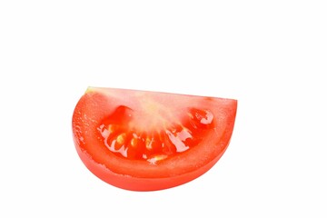 Fresh, ripe, red tomato cut into slices isolated on a white background