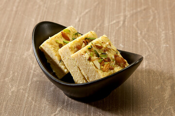 Three Piece of Sweet in a Black Bowl