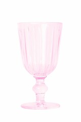 Closeup of a pink empty faceted wine glass isolated on white background