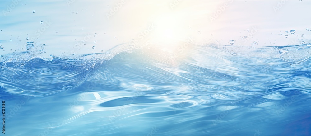 Poster blurry cream colored water surface with splashes and reflections creating a transparent and calm tex