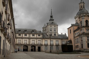 Fototapeta na wymiar Ancient La Granja de San Ildefonso royal palace in San Ildefonso, Spain against a clouded sky