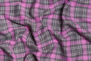 texture crumpled pink and gray tartan fabric close-up. Background for your design