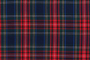 texture traditional Scottish tartan fabric in red, green and blue check. background for your design