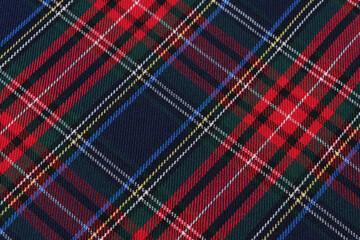 close-up texture tartan scottish style checkered fabric green, red and blue colors tilted. Image for your design - obrazy, fototapety, plakaty