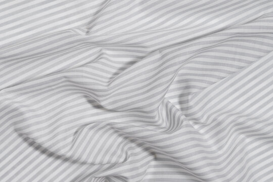 texture crumpled gray and white striped fabric close-up. Image for your design