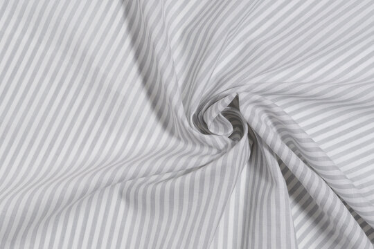 twisted cotton fabric in a gray and white stripe close-up. material for sewing concept. Image for your design