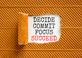 Decide commit focus succeed symbol. Concept word Decide Commit Focus Succeed on beautiful white paper. Beautiful brown paper background. Business decide commit focus succeed concept. Copy space.