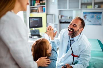 Doctor having a heartwarming interaction with a young patient