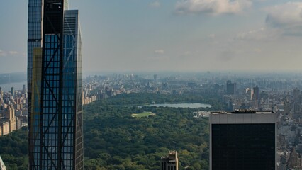 Aerial view of skyscrapers in New York city with around the Central Park on a sunny day