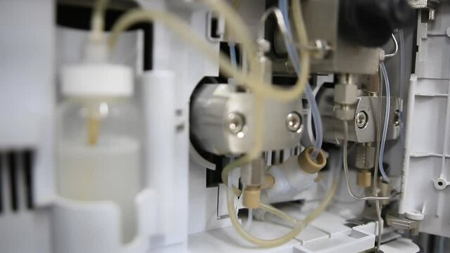 Close up from a chromatography pump used for trace level determination of chemical contaminants in food samples
