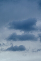 Obraz premium sky with dark heavy clouds converging, storm before the rain. Stormy sky concept