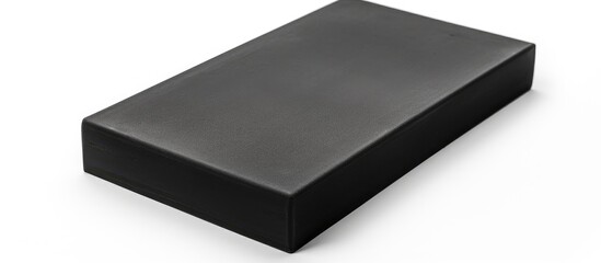 A rectangular black foam made of polyurethane with a white background serving as isolation - obrazy, fototapety, plakaty