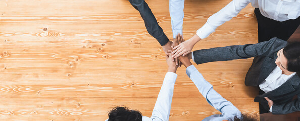 Top view panoramic banner hand stack by office worker show solidarity teamwork and trust in...
