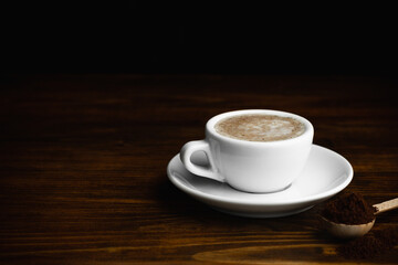 Obraz premium Cup of Cappucino Italian Coffee with Cinnamon Sticks. Copy Space