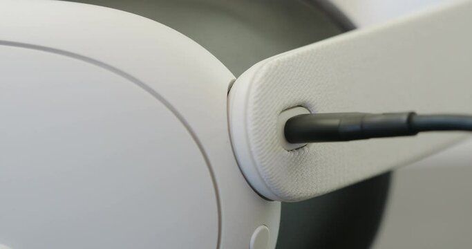 Close-up of VR Headset charging from usb cable. 