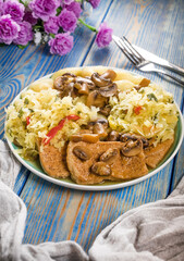 Braised pork loin with mushrooms.