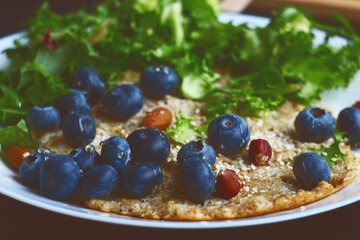 Oatmeal pancake with blueberries. Healthy breakfast.