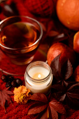 Autumn still life. A romantic autumn evening with tea and candle. Relax