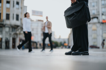 Obraz premium Successful adult business partners discussing project details outdoors in a busy city. Analyzing paperwork, reviewing statistics, and planning for profitability.