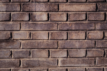 A detailed close-up of a textured brick wall