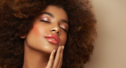 Beauty portrait of African American girl with afro hair. Beautiful black woman. Cosmetics, makeup and fashion - Powered by Adobe