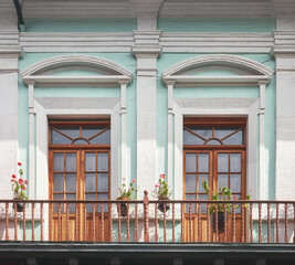 Fototapeta na wymiar Street view of an old colonial building facade in Quito, Ecuador.