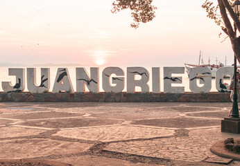 Name in concrete letters of Juan Griego, Margarita; Juan Grecia Boulevard and Malecon