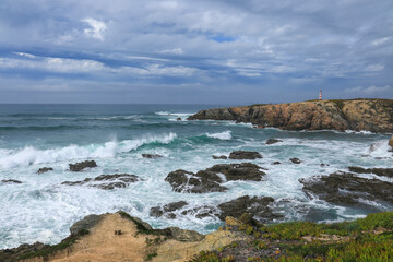 Fototapeta na wymiar Brave Atlantic Ocean on a stormy day in Porto Covo, Portugal