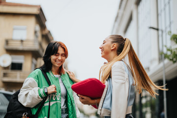 High school girls casually dressed, studying outdoors. They enjoy teamwork, helping each other with homework and preparing for exams, showing a love for learning.