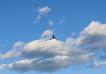 Jet airliner traveling through a clear blue sky
