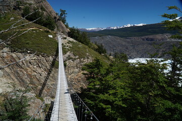 wooden hanging bridge in the mountains, Torres del Paine, Patagonia, Chile