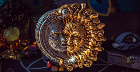 Fototapeta na wymiar Mystical concept. Venice magical detail. Masks with sun and moon. Handmade decoration